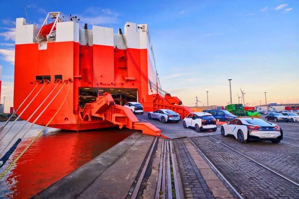 Cars driving up the ramp of a RoRo ship bound for Djen Djen